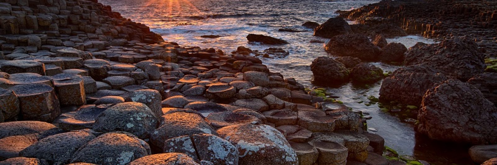 sunset over basalt columns Giant's Causeway, County Antrim, Northern Ireland